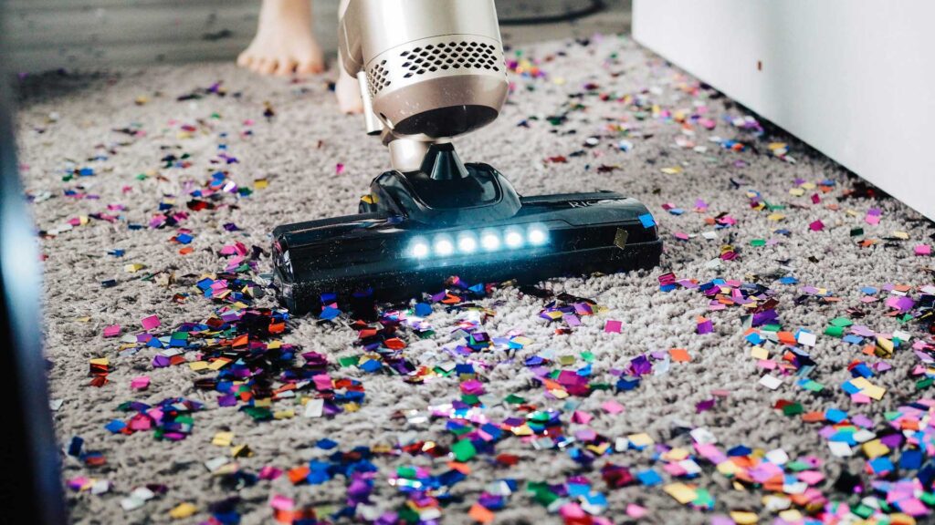 Modern Vacuum Cleaner on Carpet