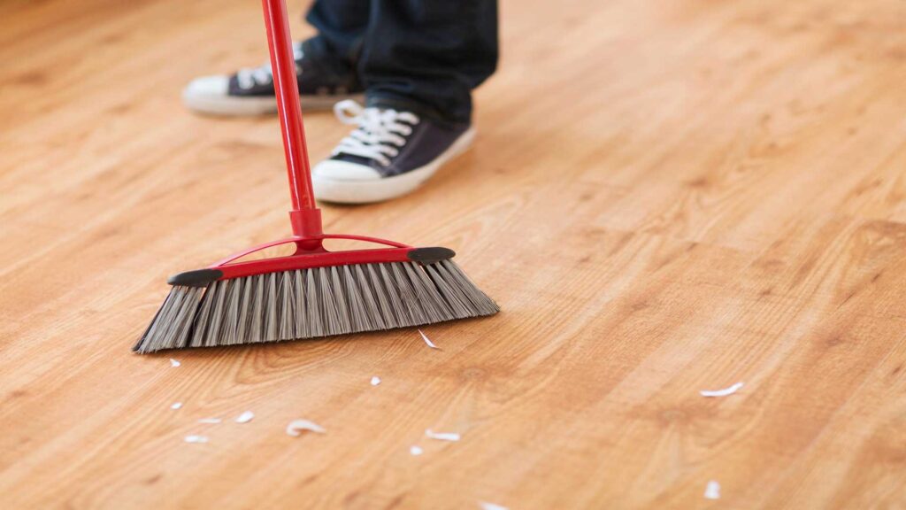 Soft broom makes it easy for wood floor cleaning hacks.