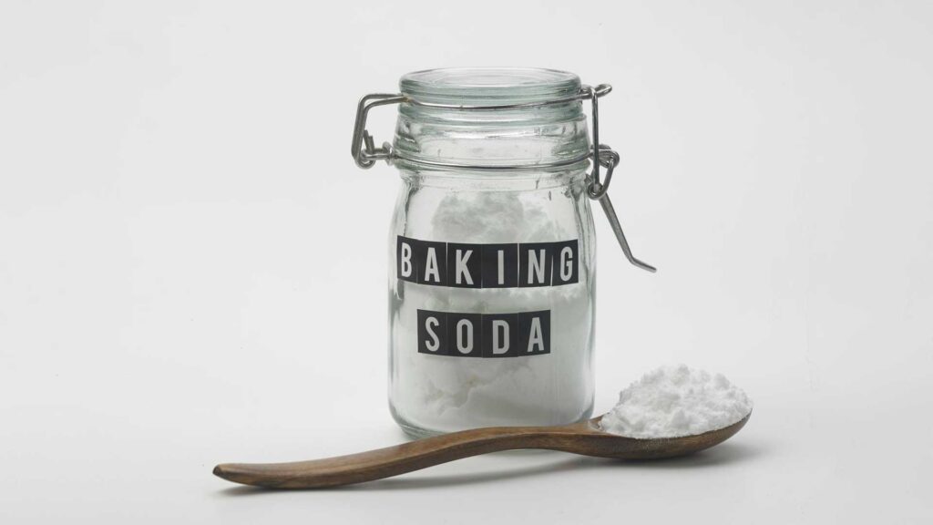 Effectiveness of Baking Soda is best to remove grease from kitchen cabinets without damaging the wood.