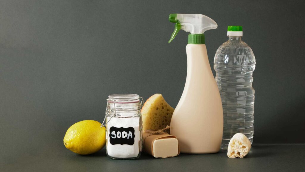 Using lemon and soda spray is how to remove grease from kitchen cabinets without damaging the wood.