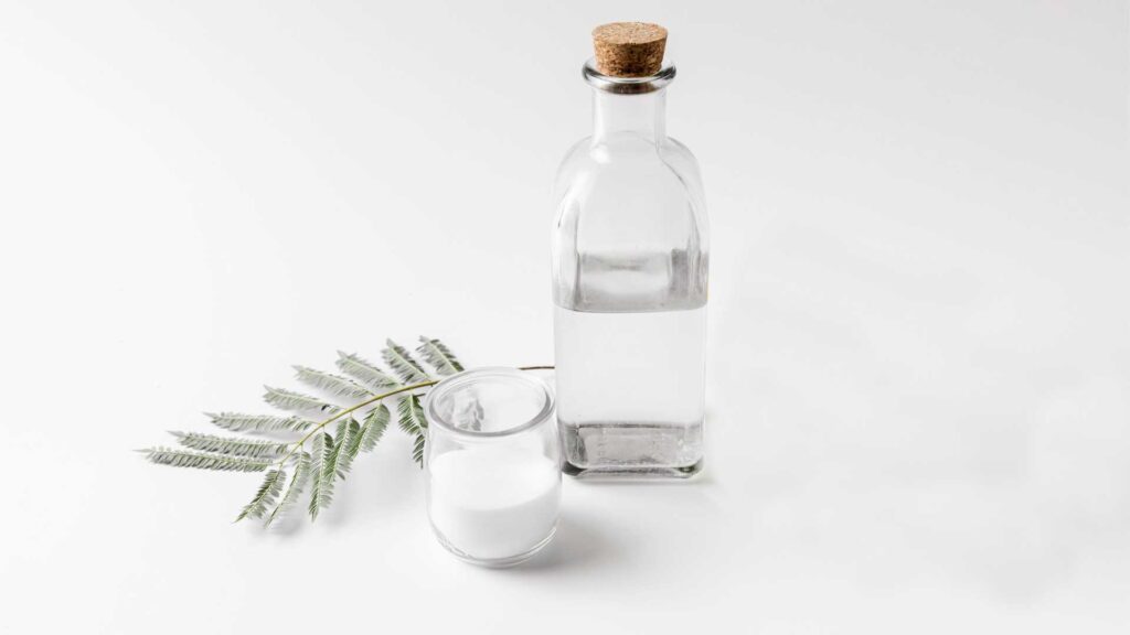Vinegar and salt is the combination on how to remove grease from kitchen cabinets without damaging the wood.
