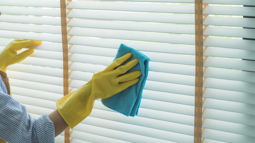 Wipe your down blinds with damp cloth.