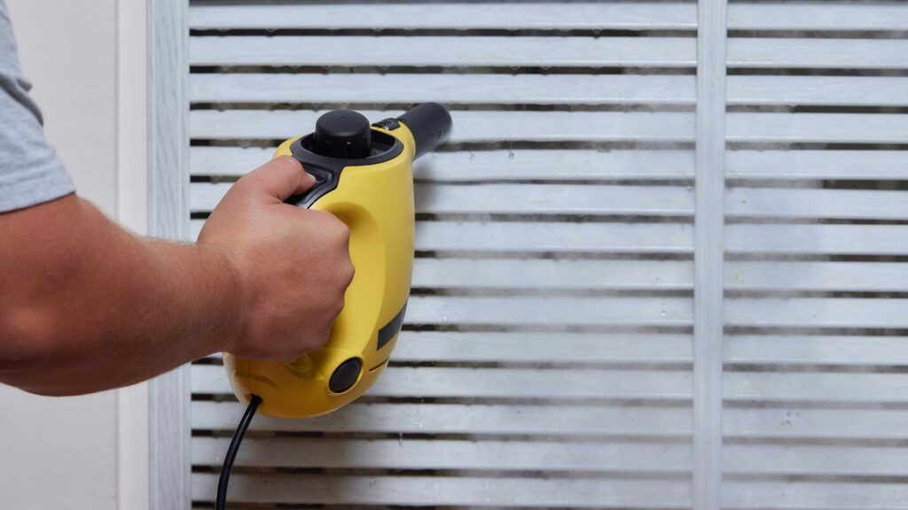 Using a vacuum is how to clean faux wood blinds.